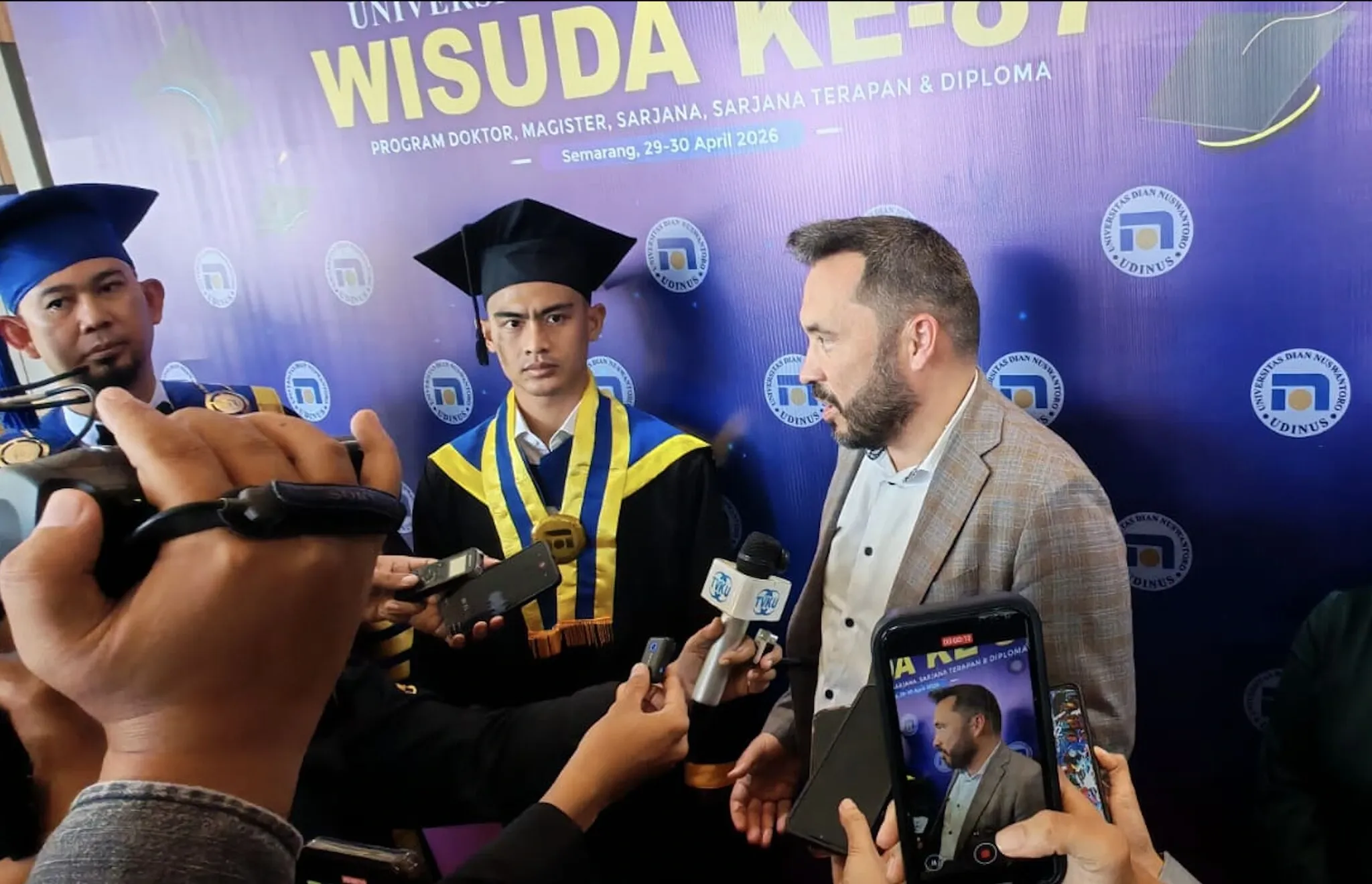 Igor Arkhypenko, founder of Top Netics, speaks to Indonesian media at Udinus graduation about Sealbound blockchain diploma verification
